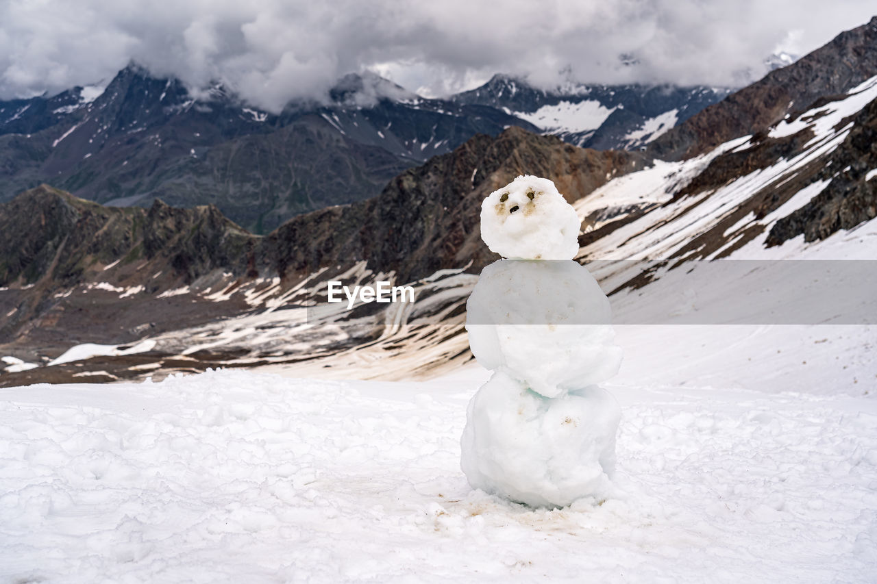 WHITE SNOW COVERED LAND AND MOUNTAIN