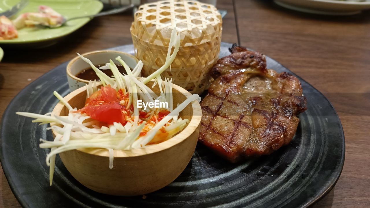 food and drink, food, dish, meal, freshness, meat, plate, healthy eating, table, vegetable, indoors, fast food, cuisine, no people, wellbeing, breakfast, still life, lunch, close-up, serving size, wood, focus on foreground, salad, bowl