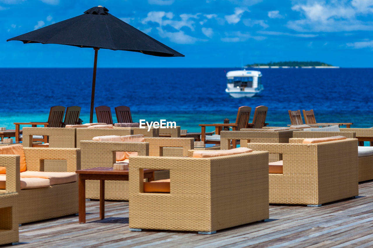 DECK CHAIRS ON BEACH