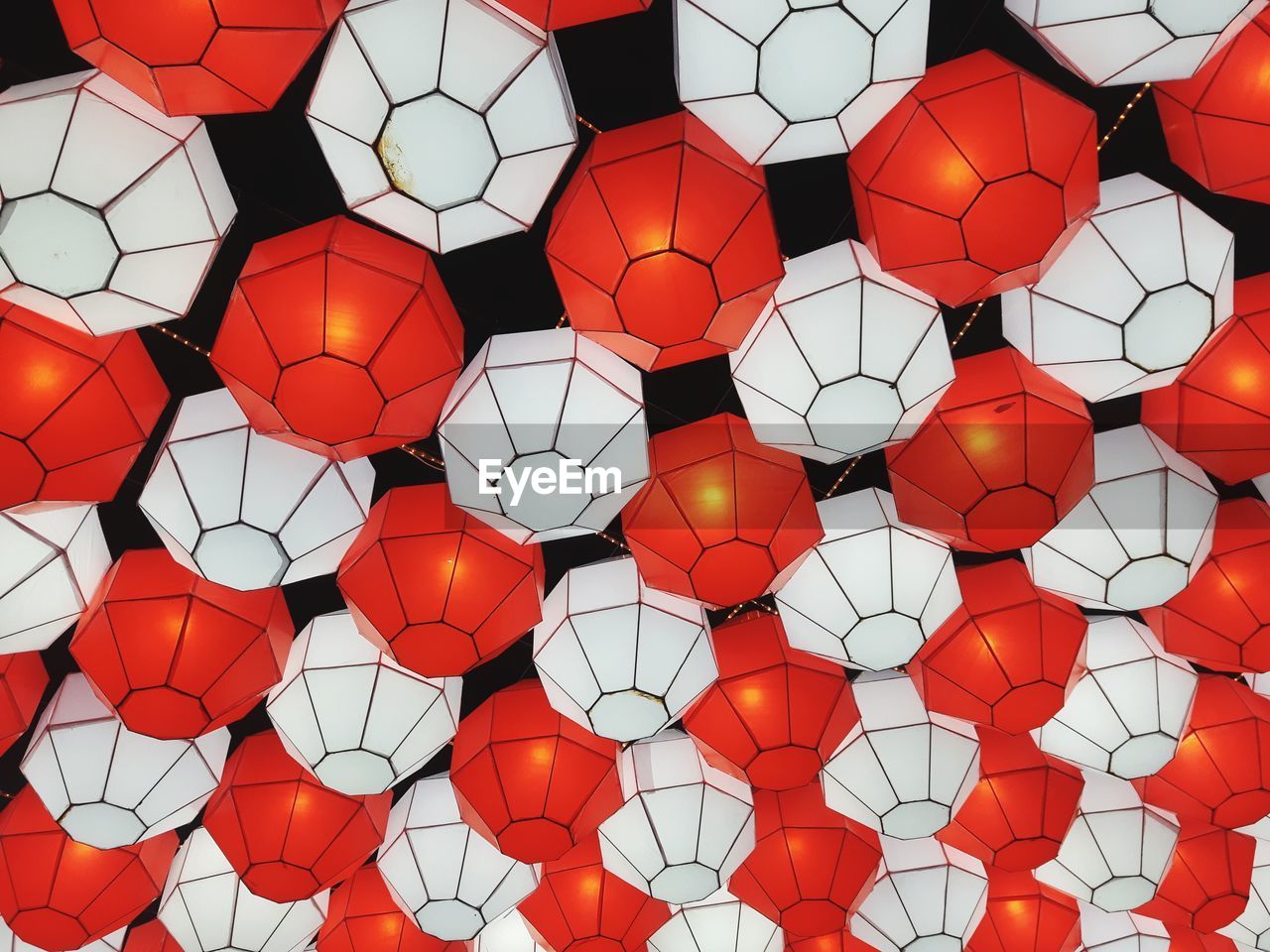 Full frame shot of illuminated lanterns hanging outdoors at night