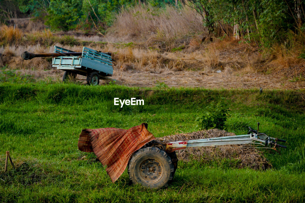 SIDE VIEW OF VEHICLE ON FIELD