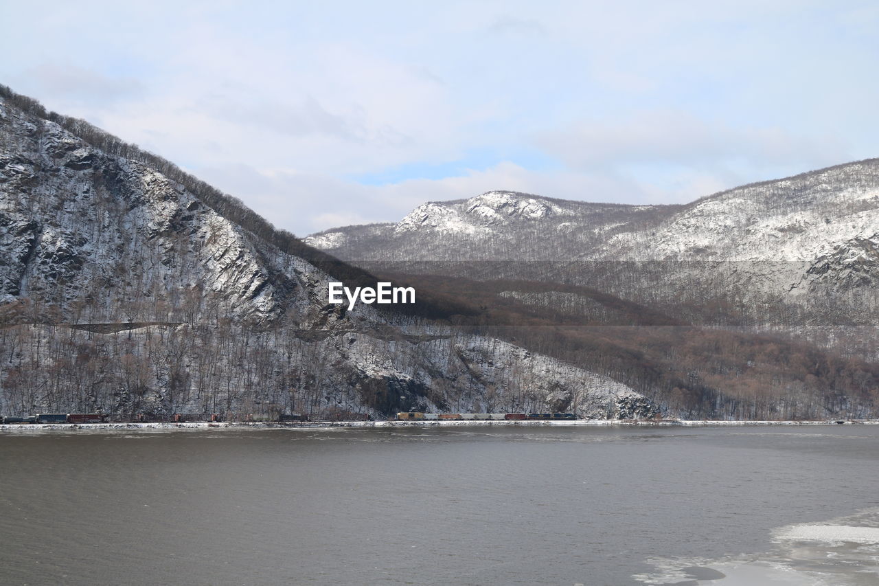 Scenic view of mountains against sky during winter