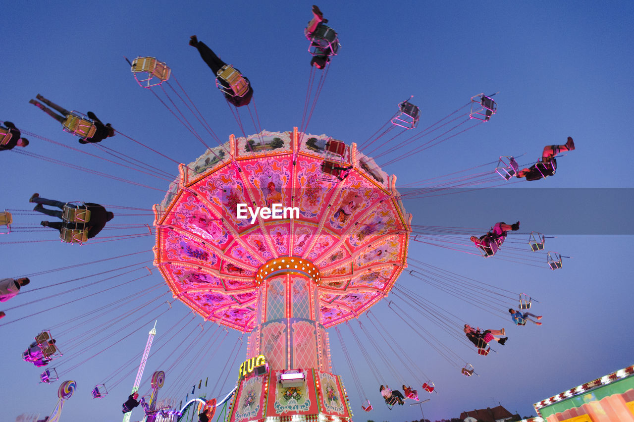 LOW ANGLE VIEW OF AMUSEMENT PARK AGAINST SKY