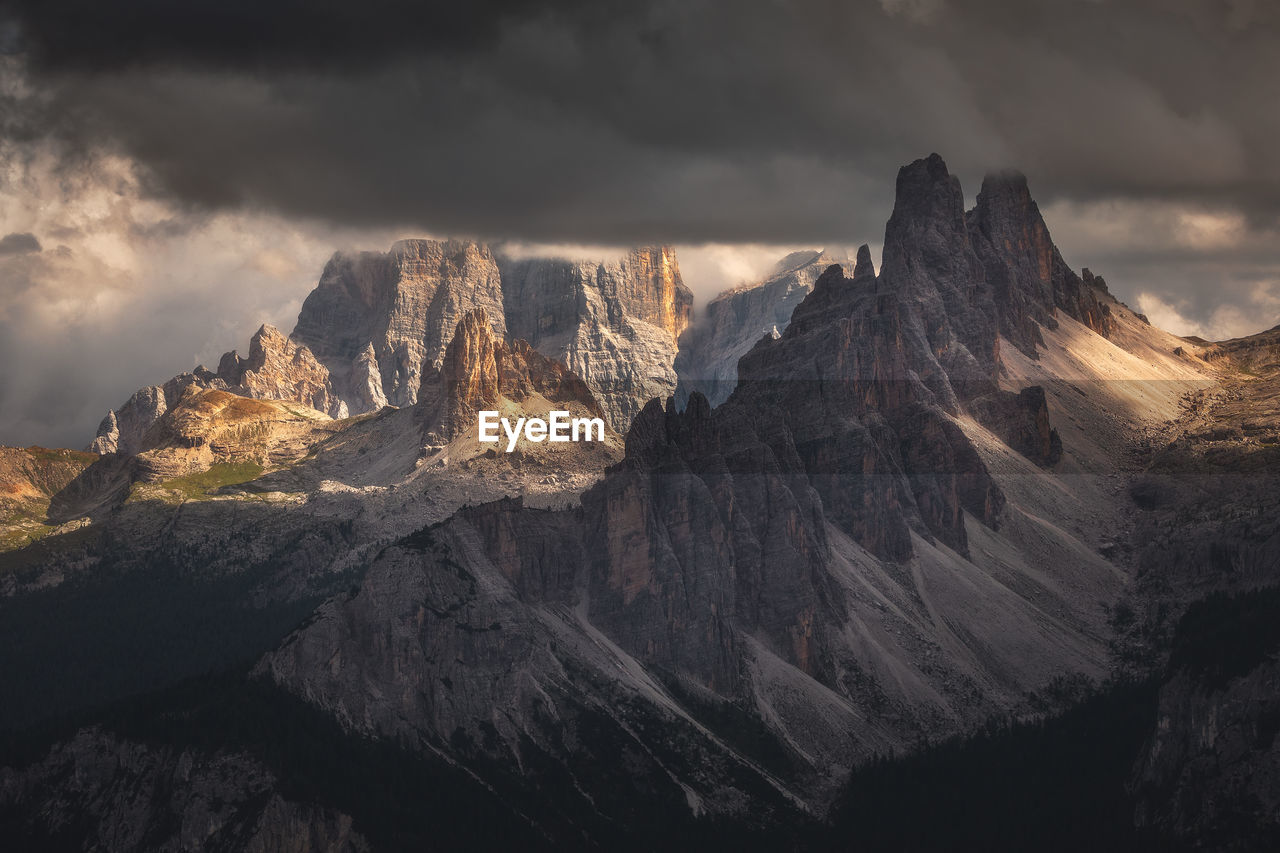 Moody landscape with dolomite mountains in perfect sunset light.