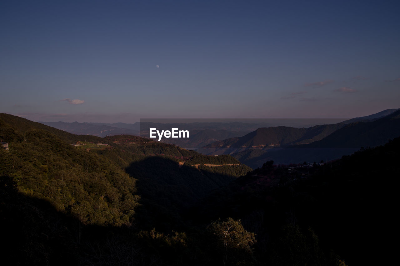 SCENIC VIEW OF LANDSCAPE AGAINST SKY AT NIGHT