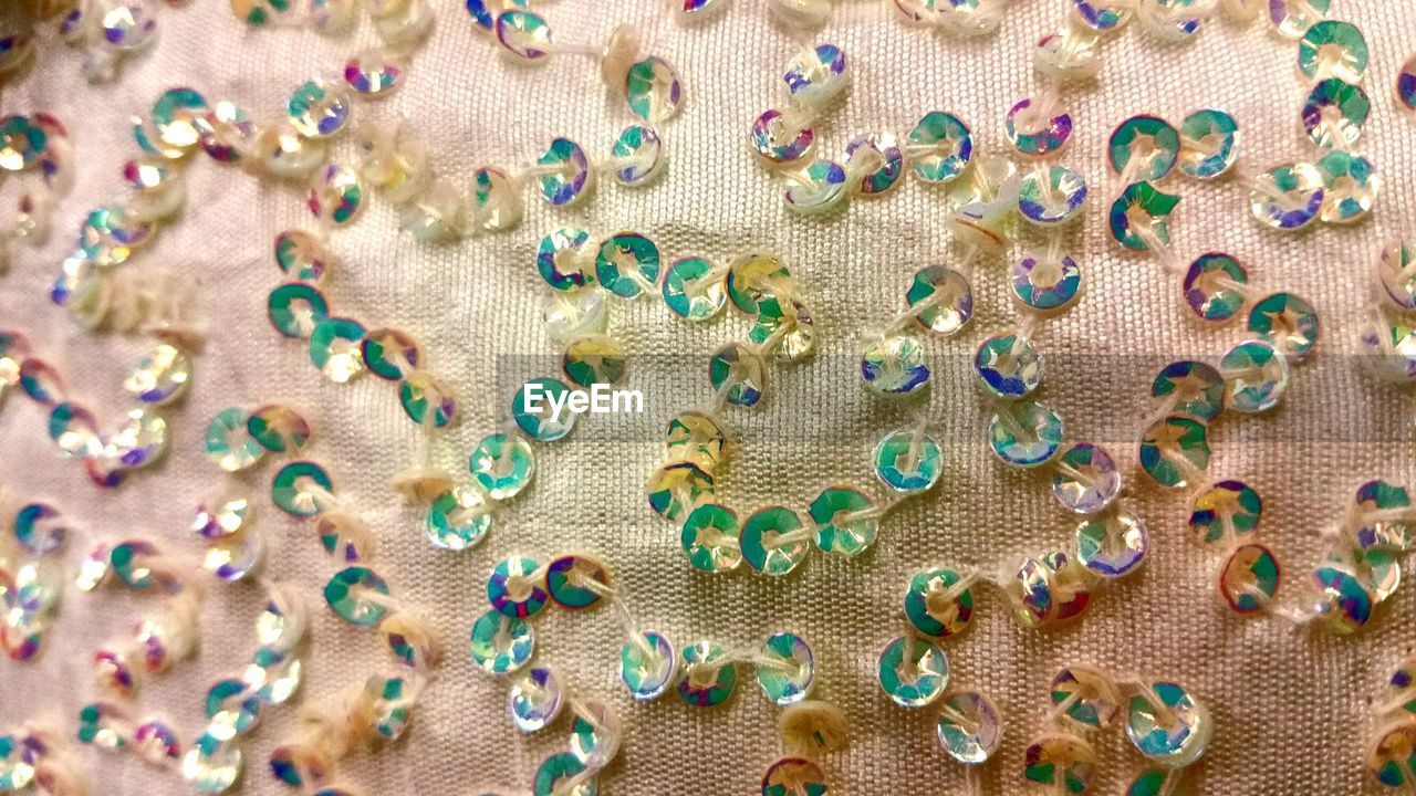 Close-up of sequins on fabric