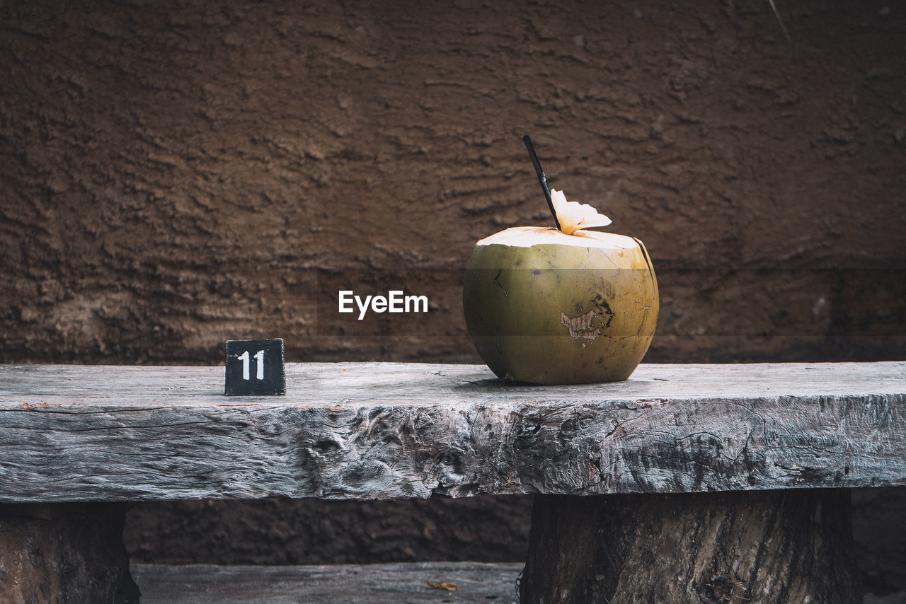 Close-up of coconut on wooden table