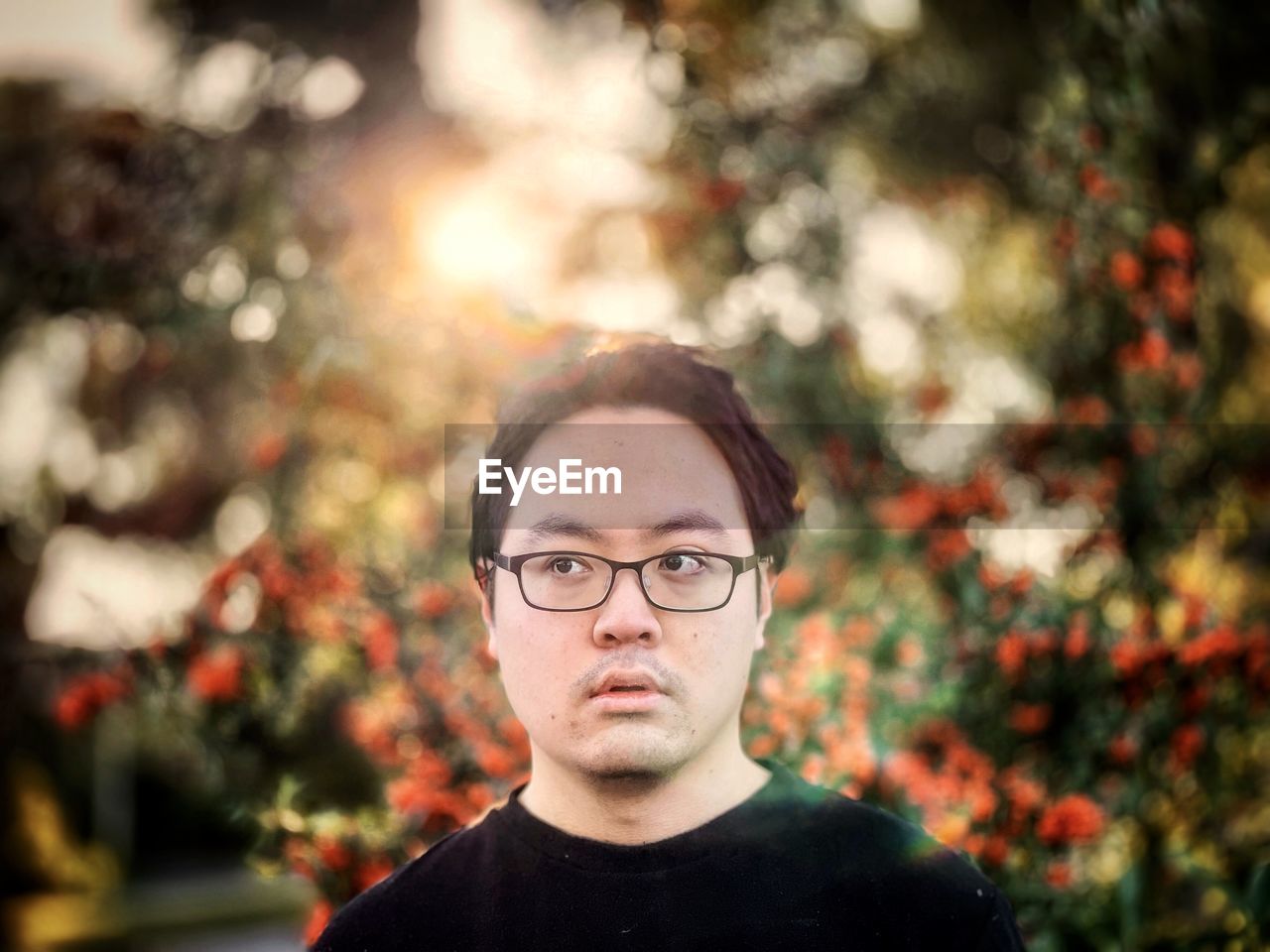 PORTRAIT OF TEENAGE BOY WEARING SUNGLASSES