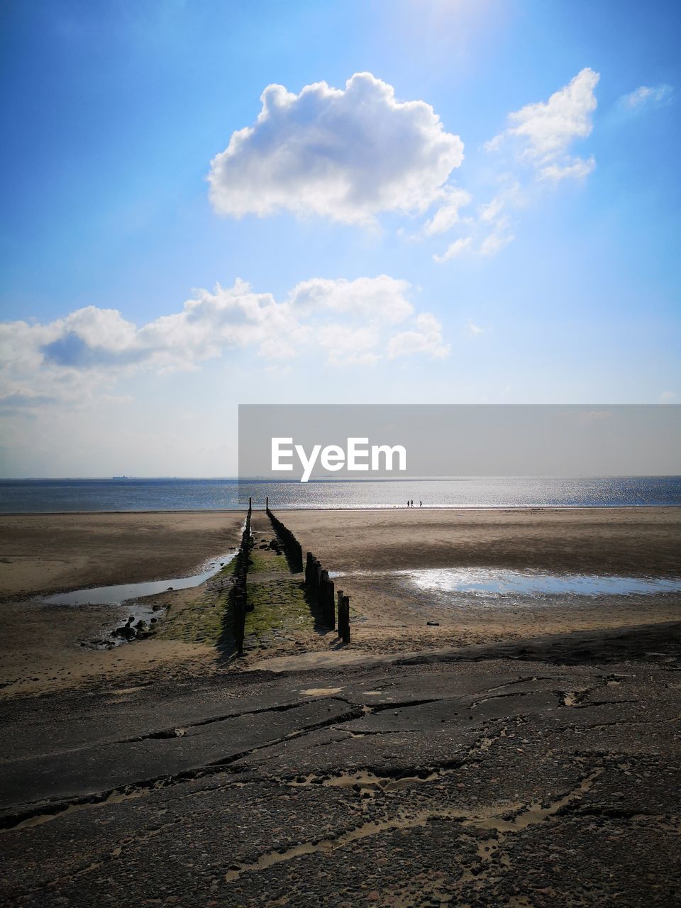 GROYNE ON BEACH AGAINST SKY