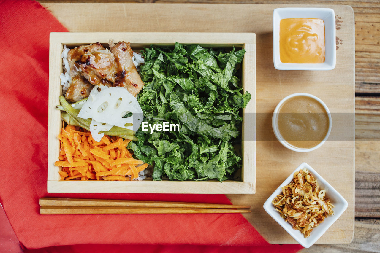 Overhead view of food served on table in commercial kitchen