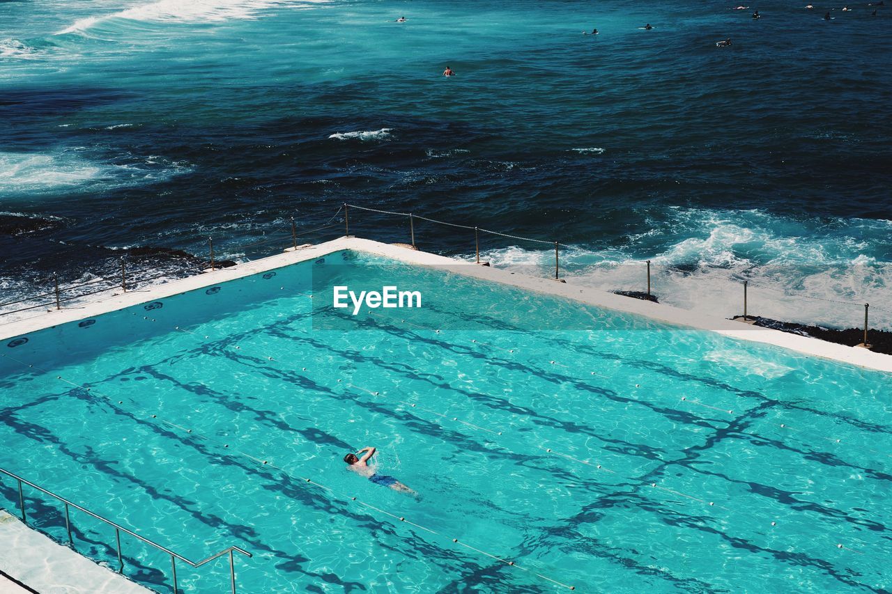 High angle view of infinity pool by sea