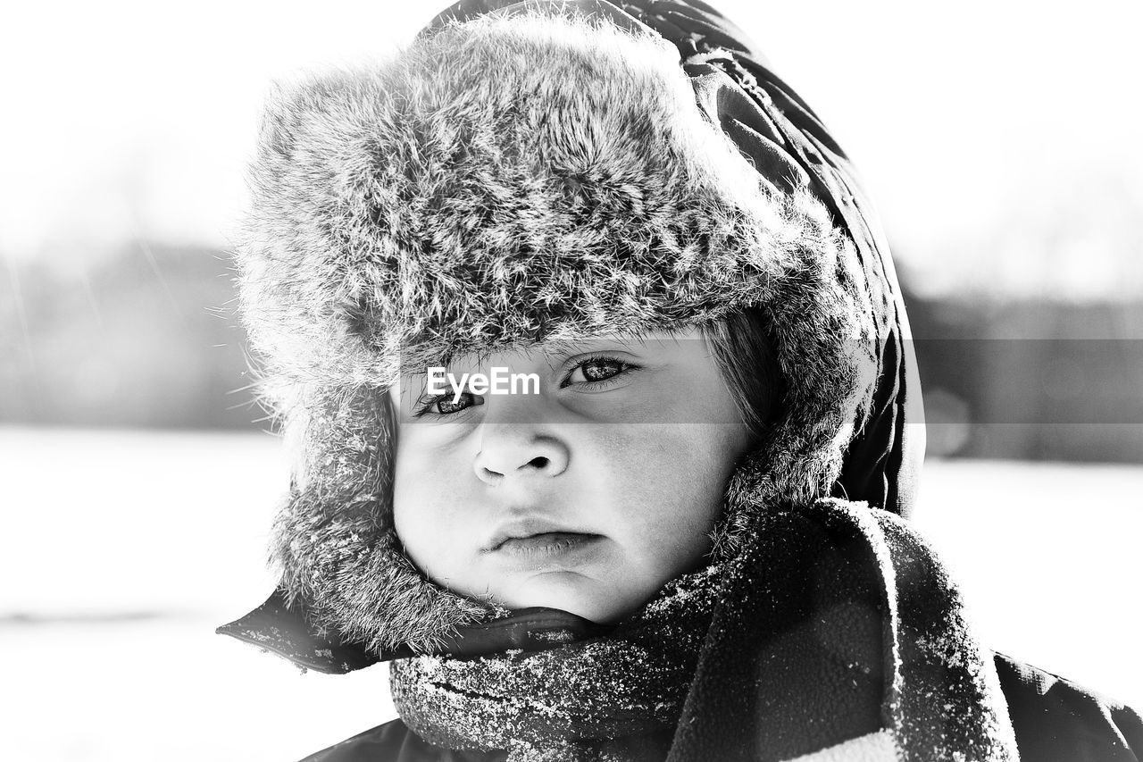 Close-up portrait of boy in snow