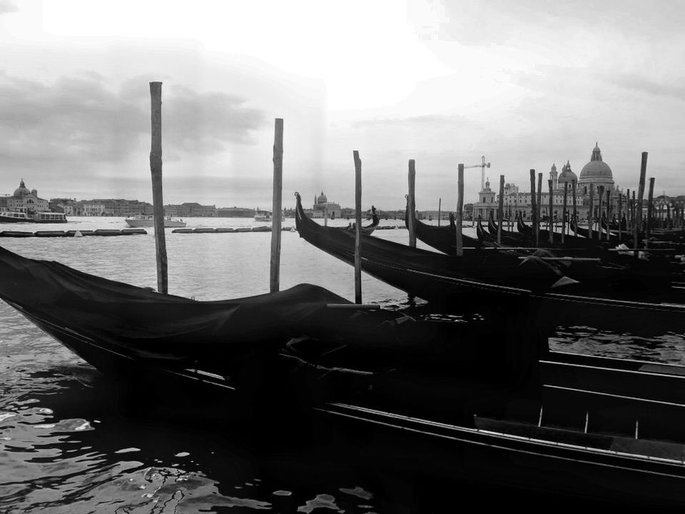 BOATS MOORED IN HARBOR