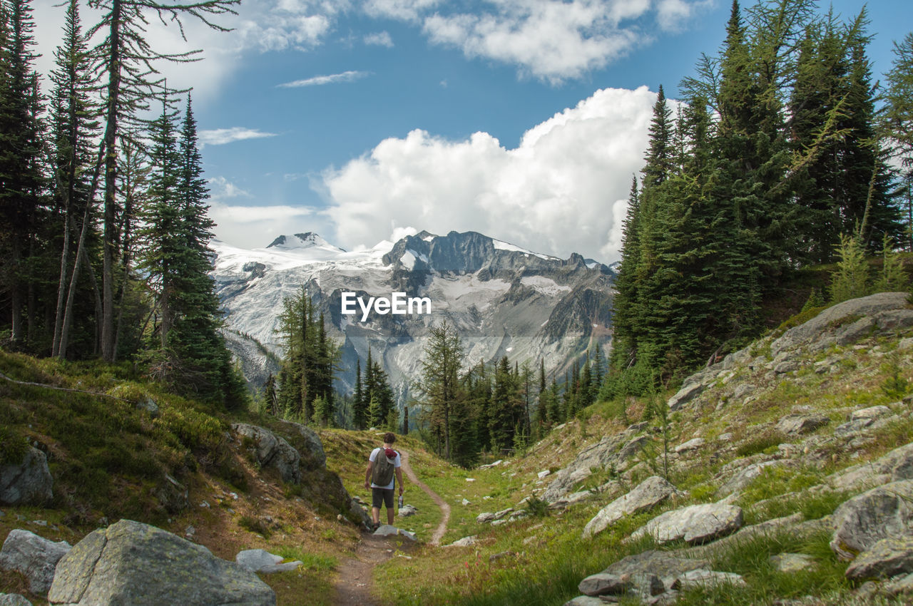 Man hiking against mountain