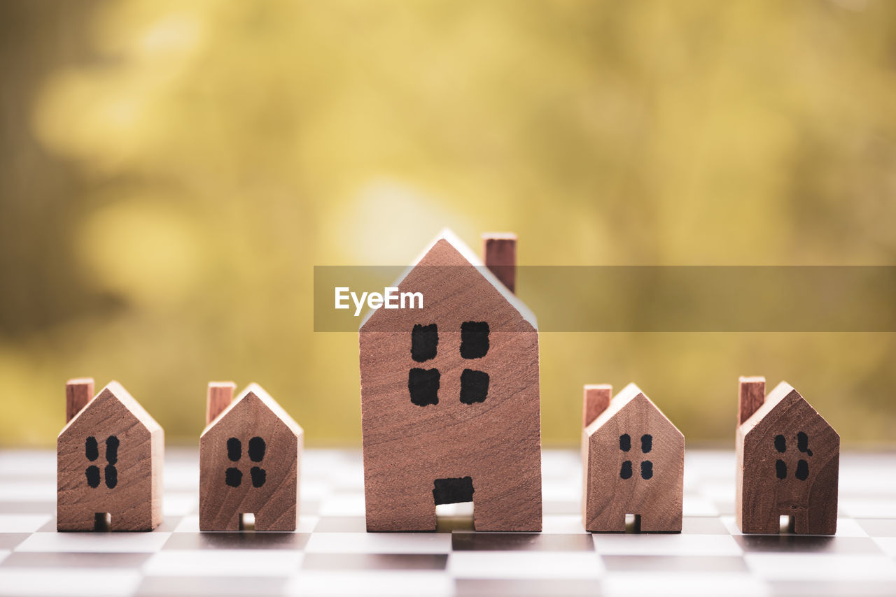 close-up of model house on wooden table