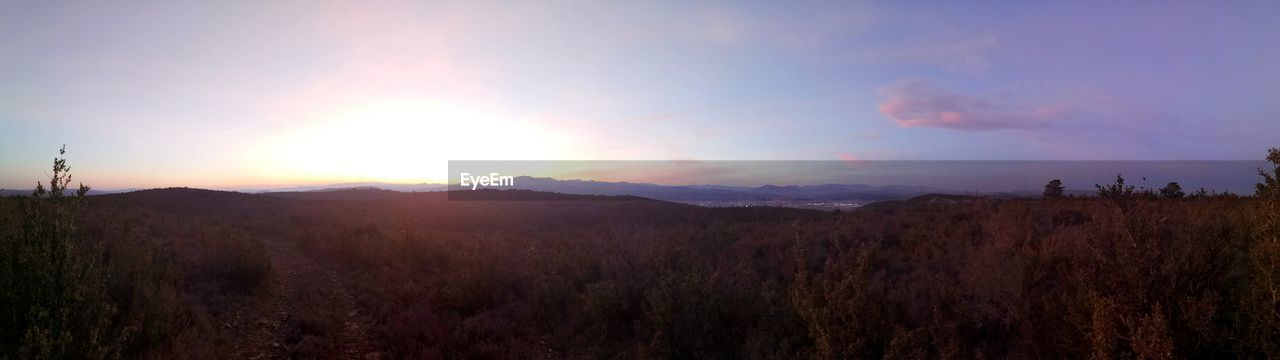 PANORAMIC VIEW OF LANDSCAPE AGAINST SKY DURING SUNSET