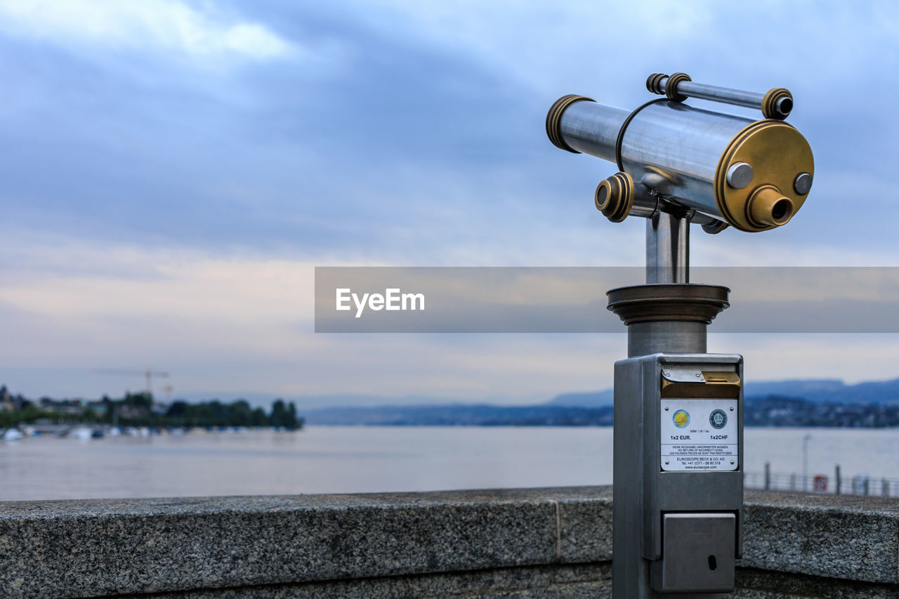 sky, coin operated, binoculars, coin-operated binoculars, water, cloud, nature, surveillance, security, sea, observation point, architecture, no people, day, scenics - nature, technology, outdoors, protection, city, beach, railing, built structure, optical instrument, telescope, travel destinations, blue, beauty in nature, tower, focus on foreground, astronomy, communication
