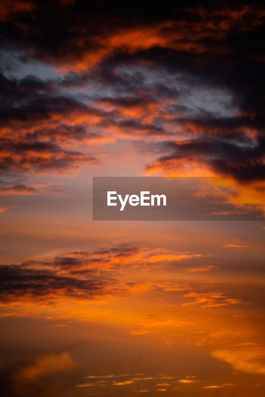 Low angle view of dramatic sky during sunset