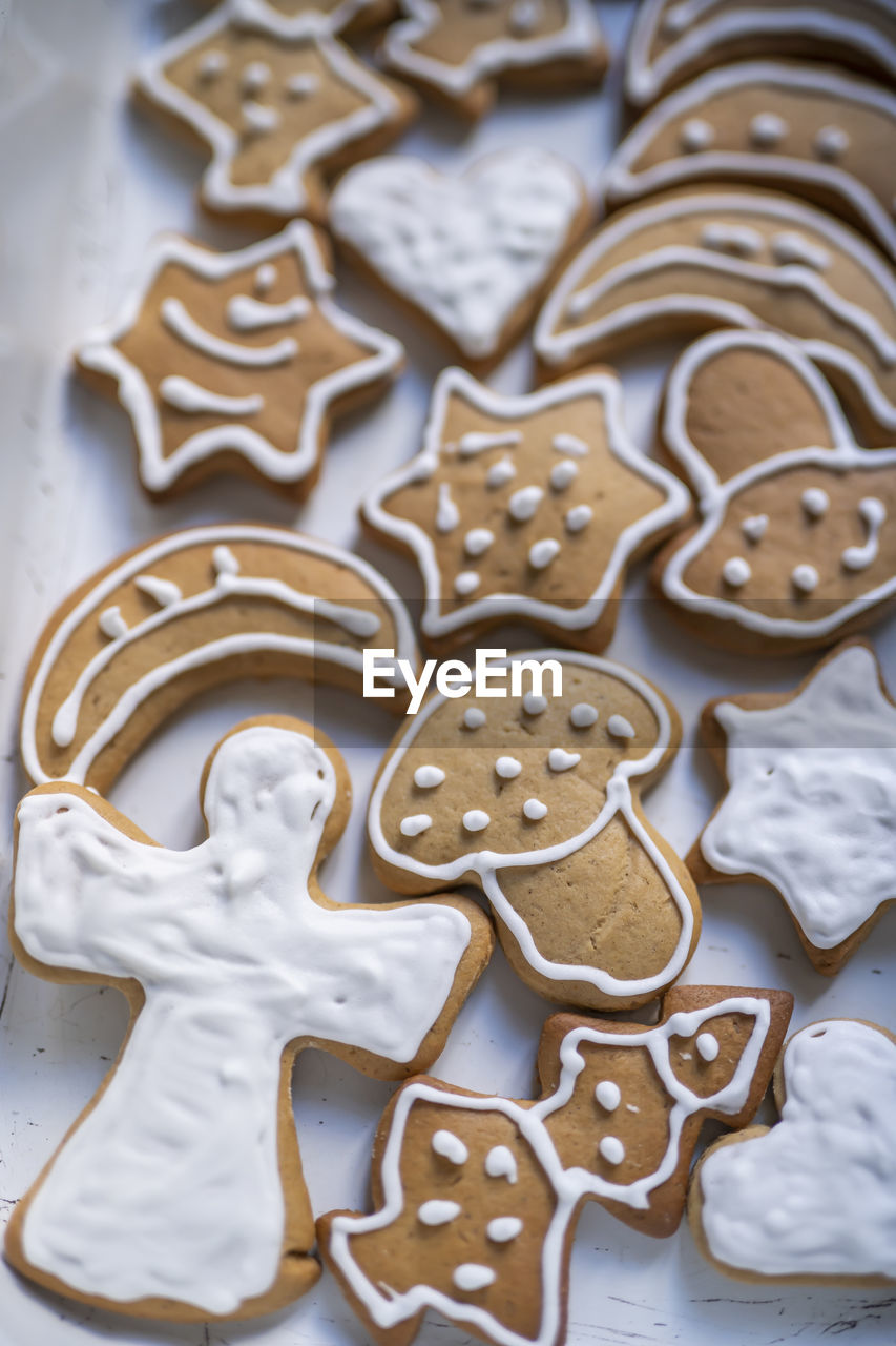 High angle view of ginger bread, christmas  cookies in cake pan on table.