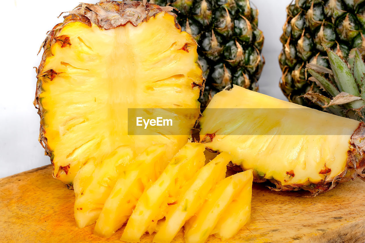 pineapple, ananas, food and drink, food, fruit, healthy eating, plant, bromeliaceae, produce, freshness, wellbeing, tropical fruit, slice, no people, close-up, indoors, yellow, still life, studio shot, ripe, vegetable, cross section