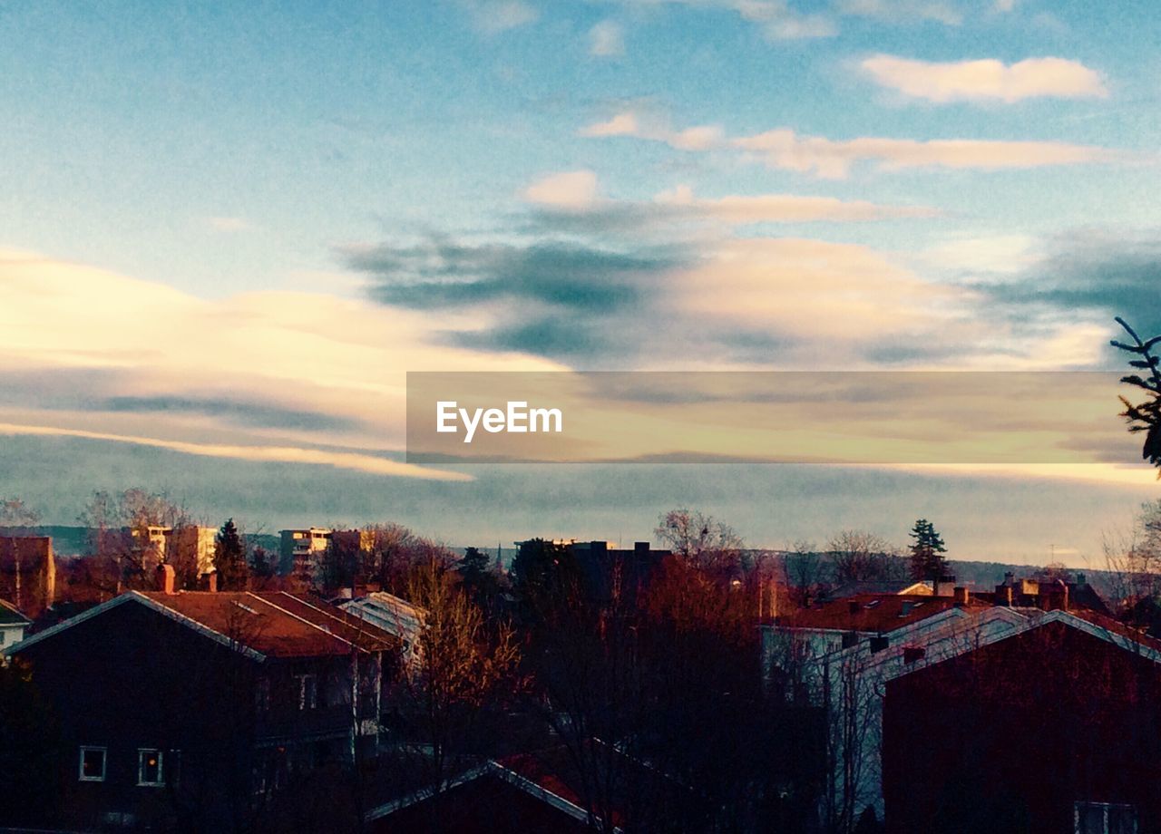 AERIAL VIEW OF CITY AGAINST SKY DURING SUNSET