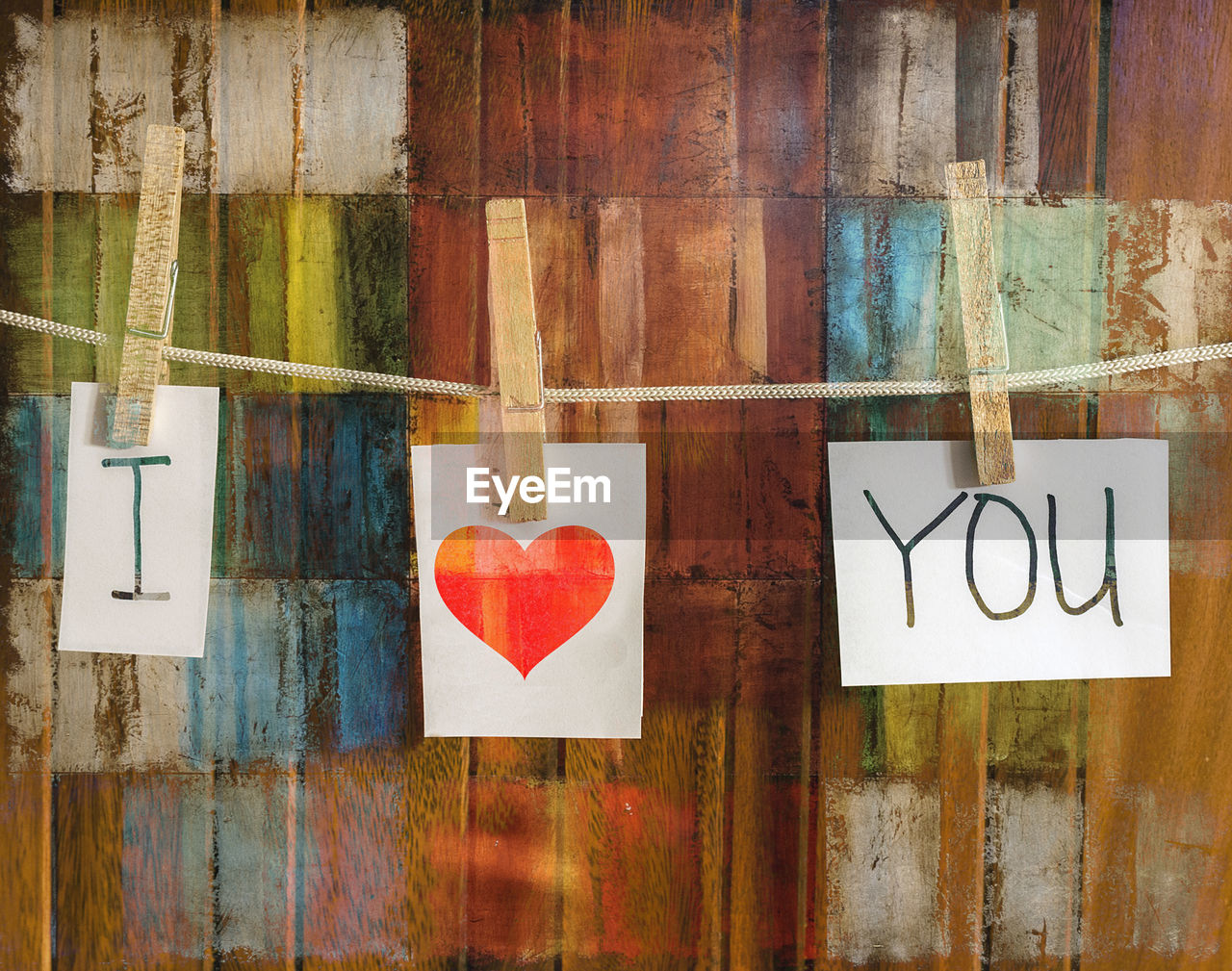 Close-up of heart shape text on wall