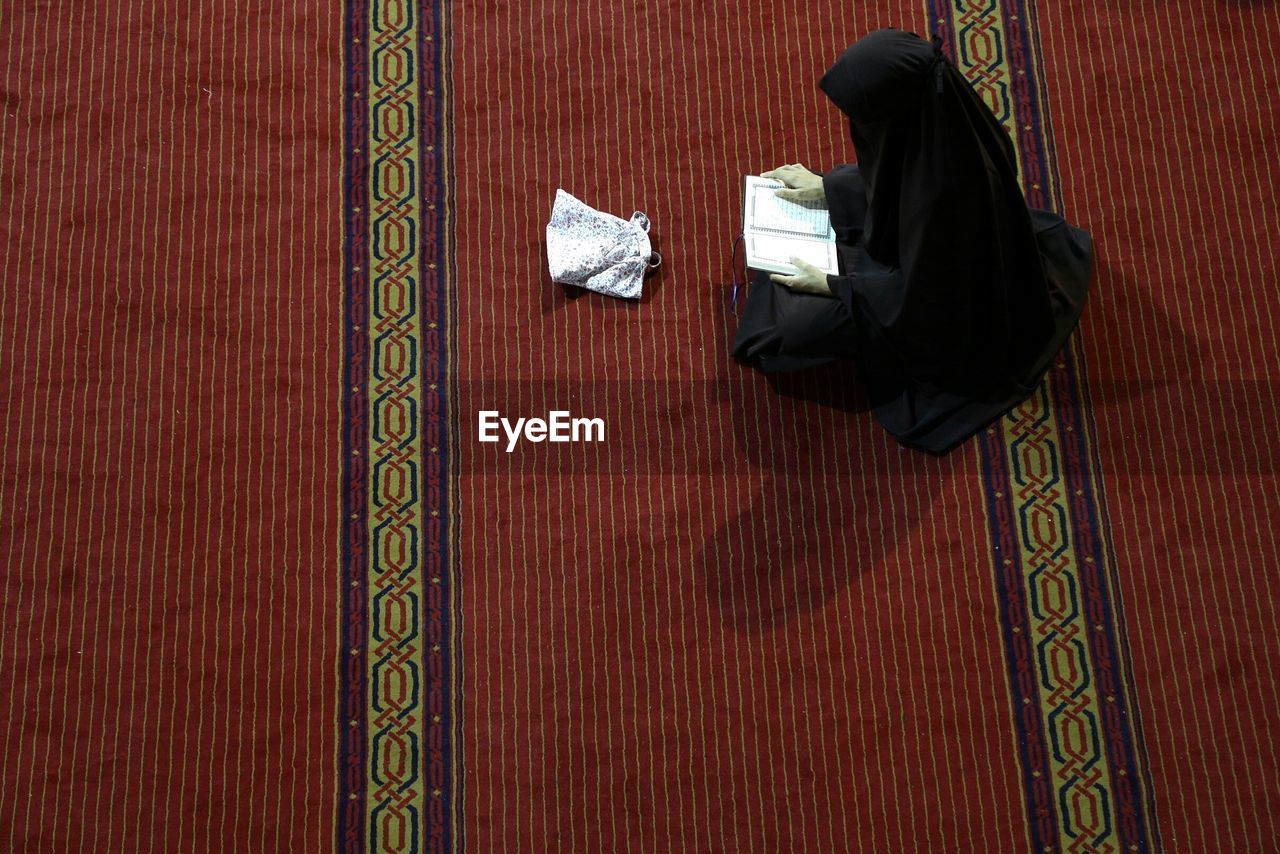 Muslim woman praying in mosque