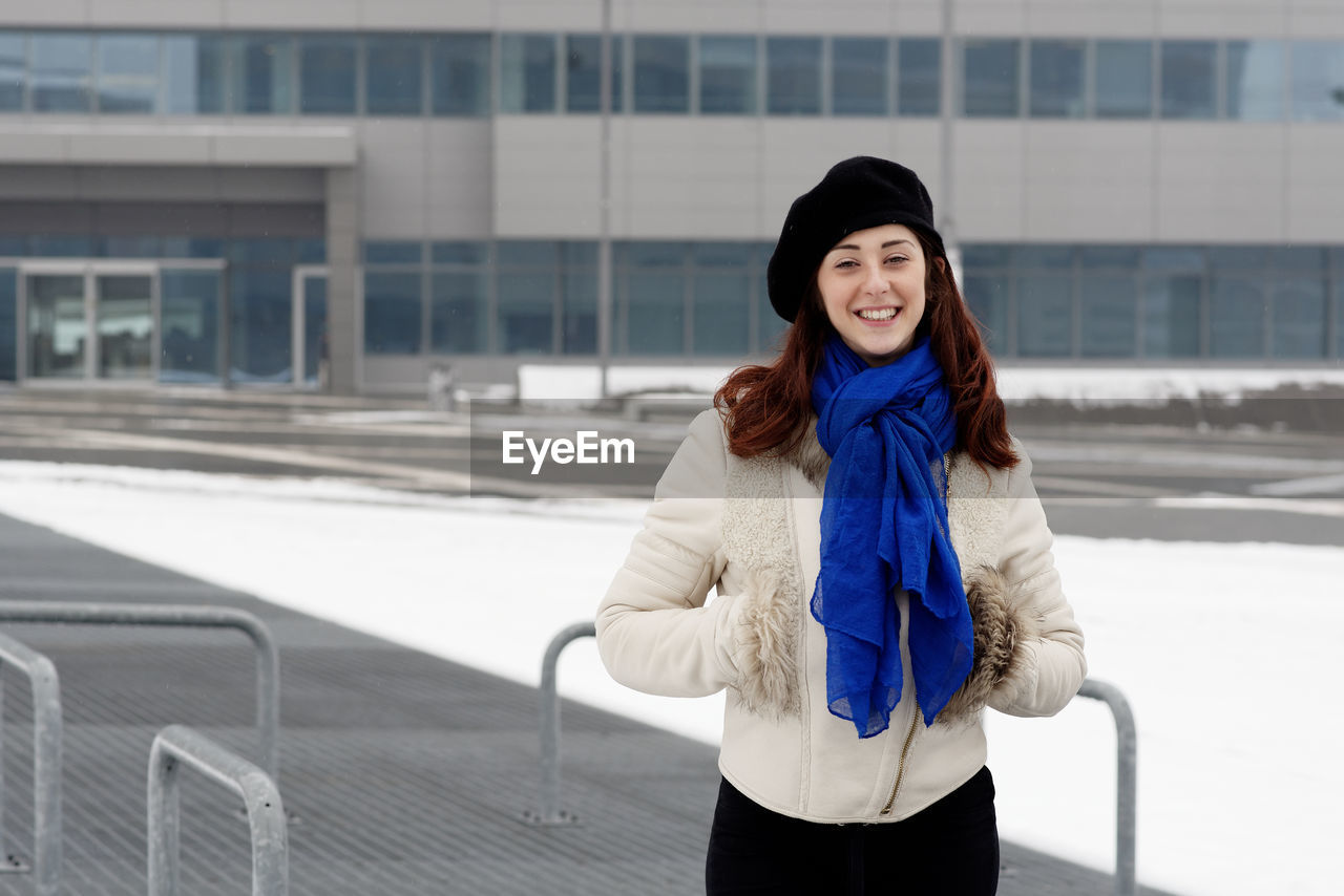 Portrait of a smiling young woman in winter