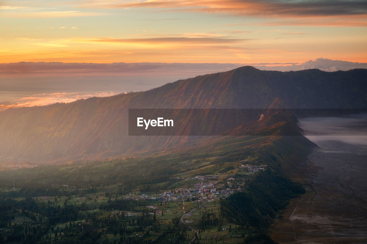 Scenic view of mountains against sky during sunset