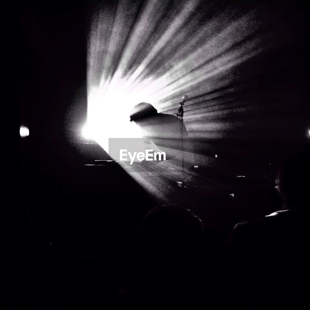 Silhouette dj playing music in nightclub