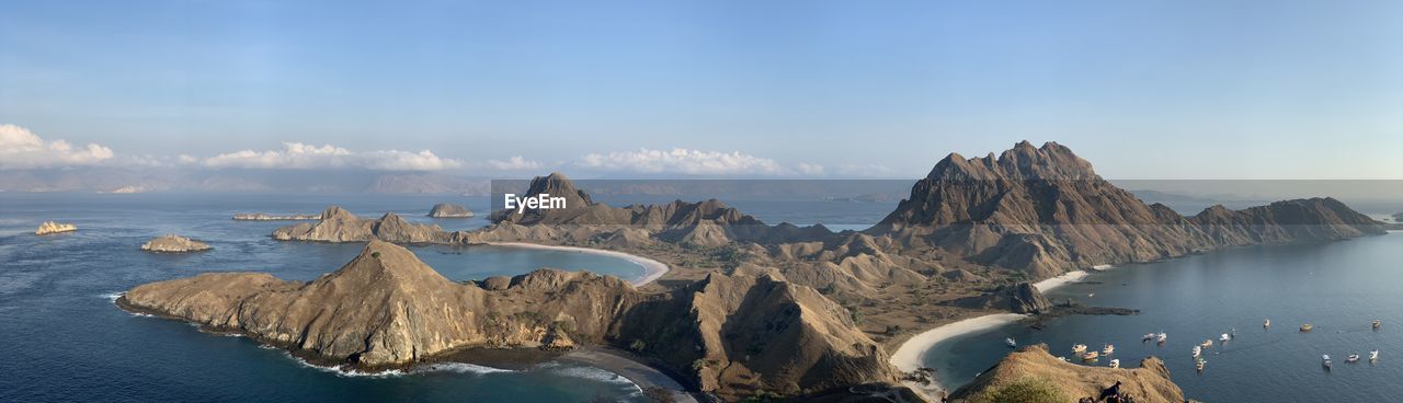 Panoramic view of sea and mountains against sky on padar island komodo 