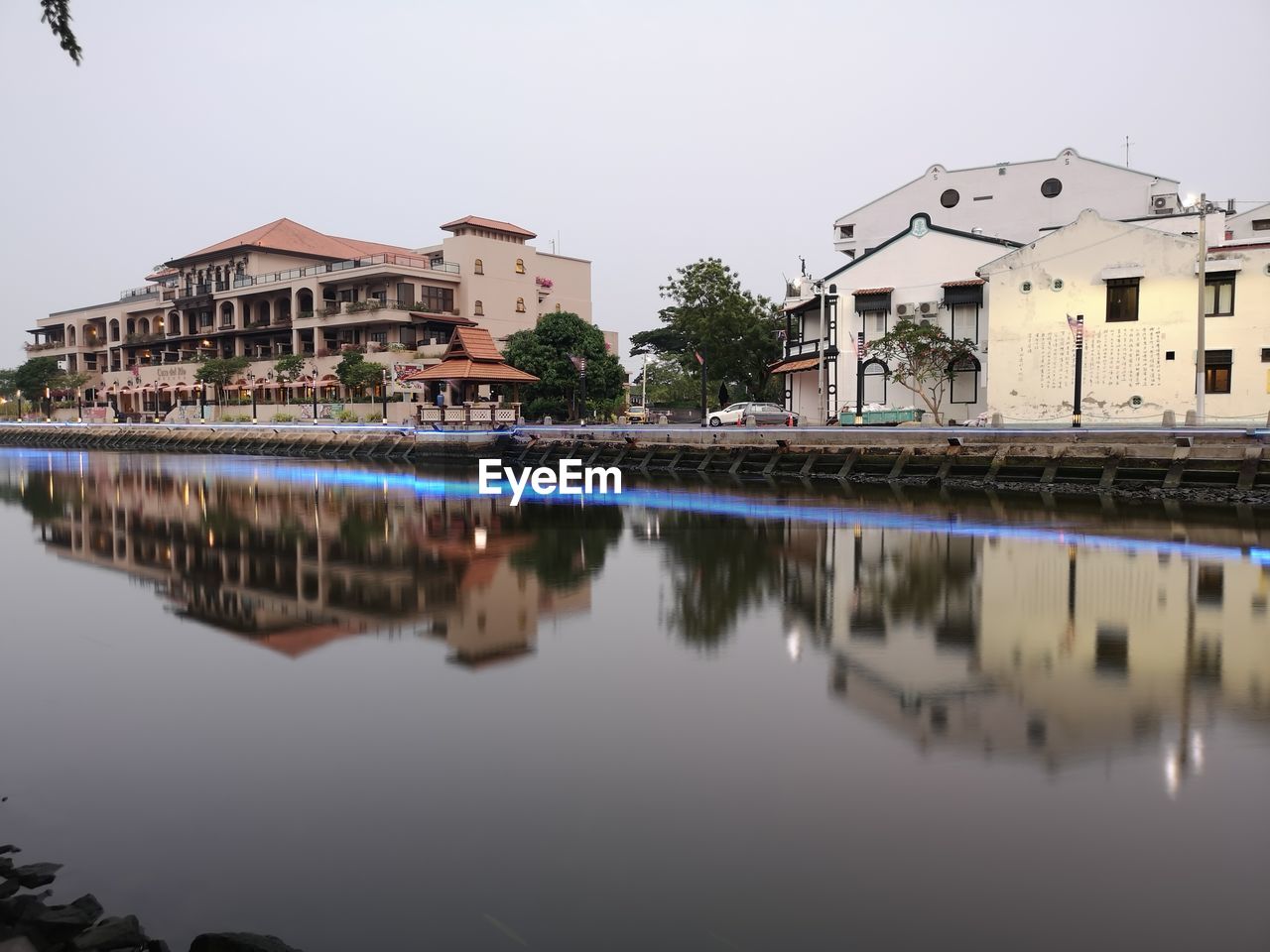 REFLECTION OF BUILDING IN LAKE