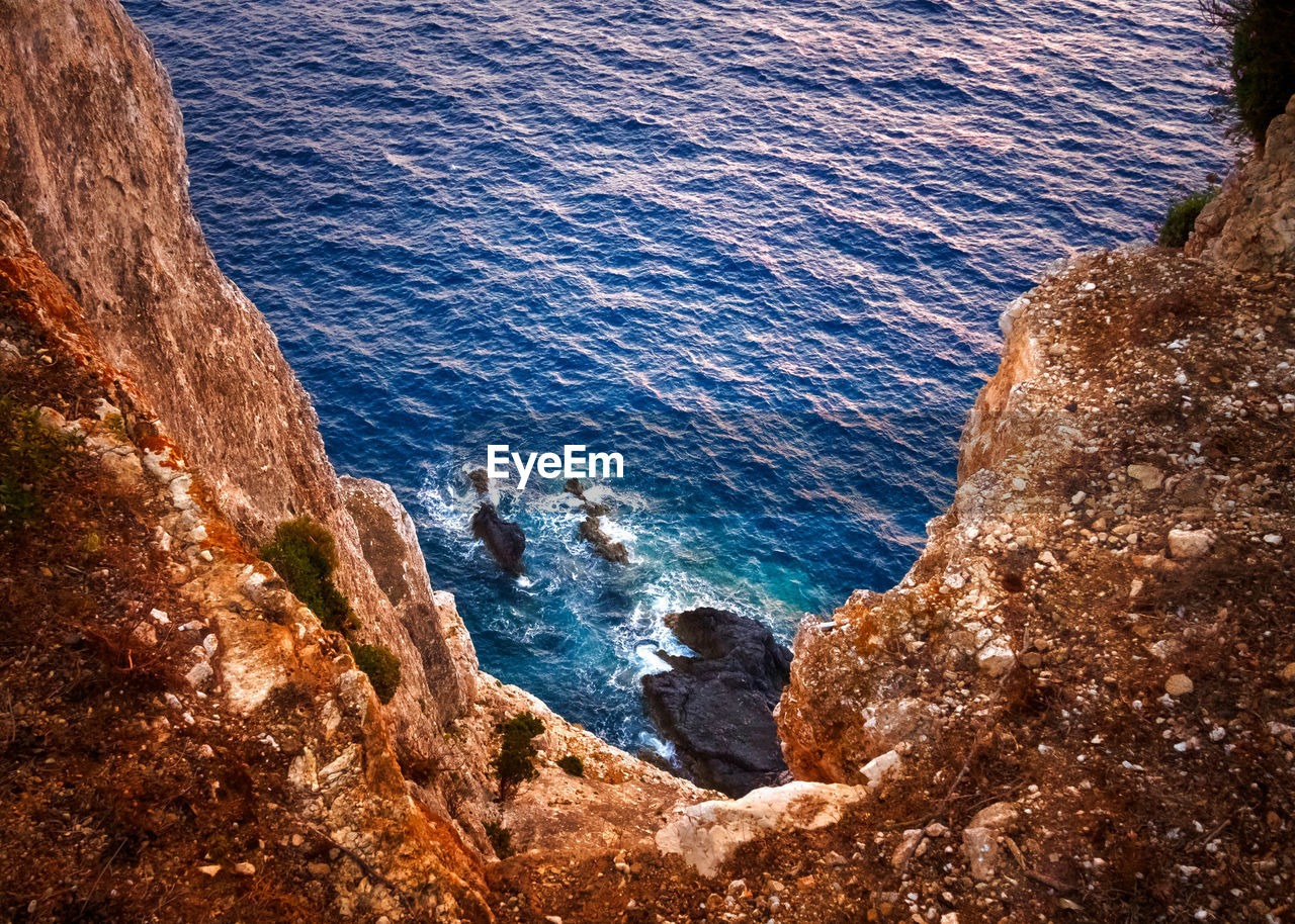 High angle view of rock formation by sea