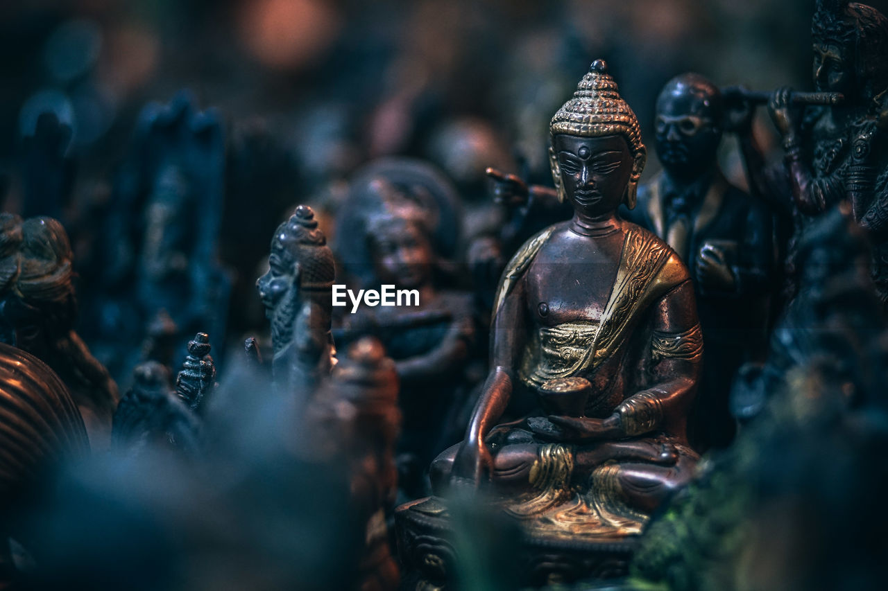 Close-up of buddha statue at market stall