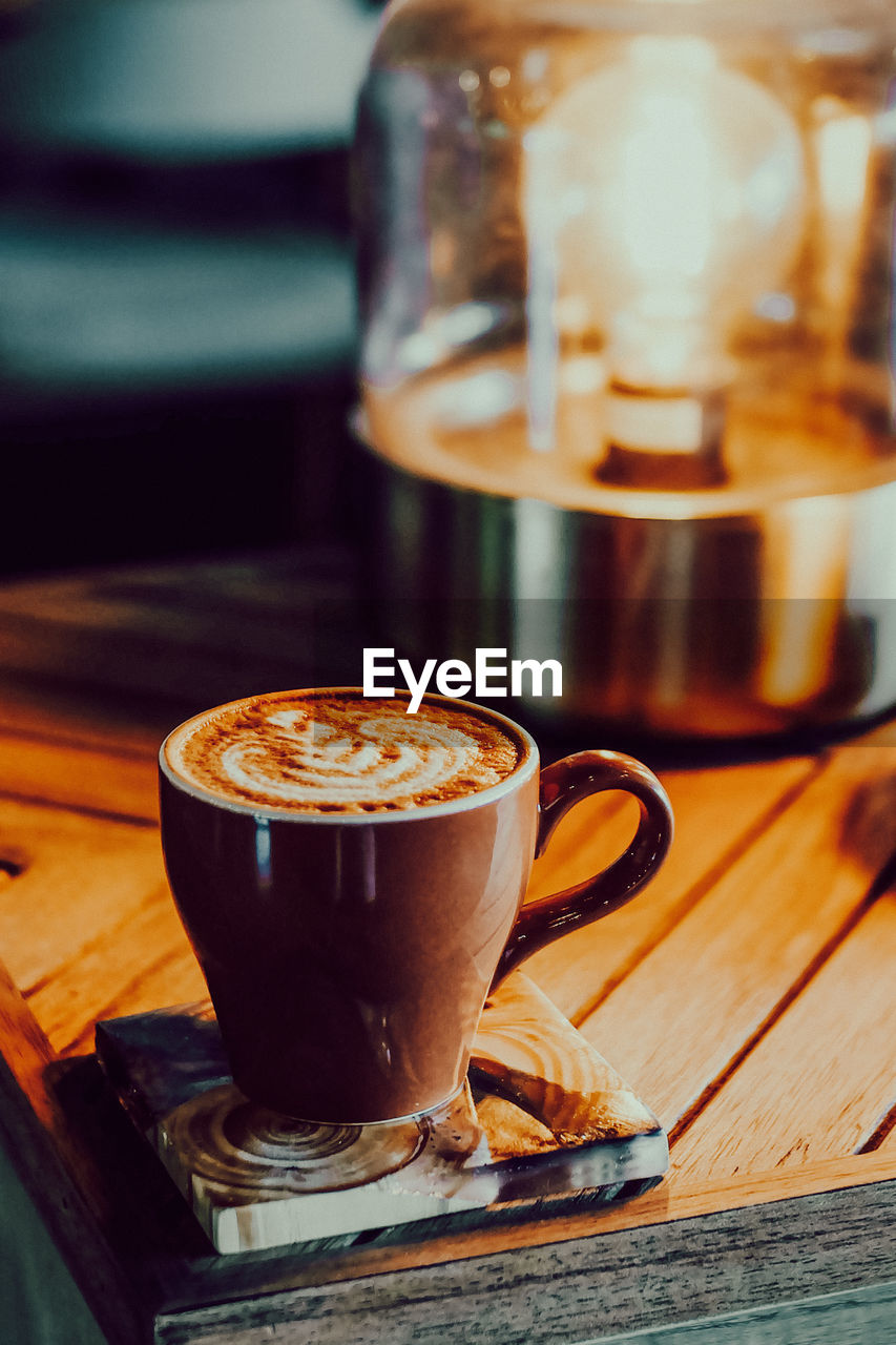 Close-up of coffee cup on table