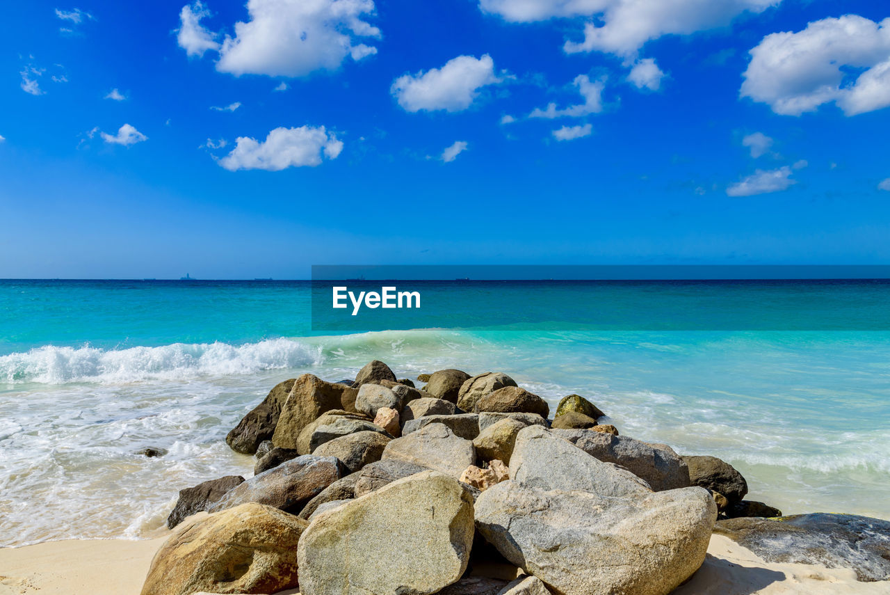 Scenic view of sea against blue sky