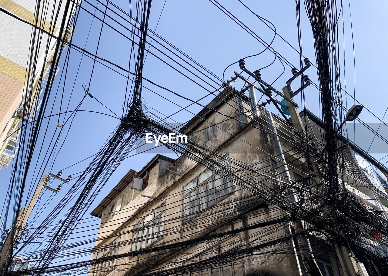 LOW ANGLE VIEW OF ELECTRICITY PYLONS AGAINST SKY