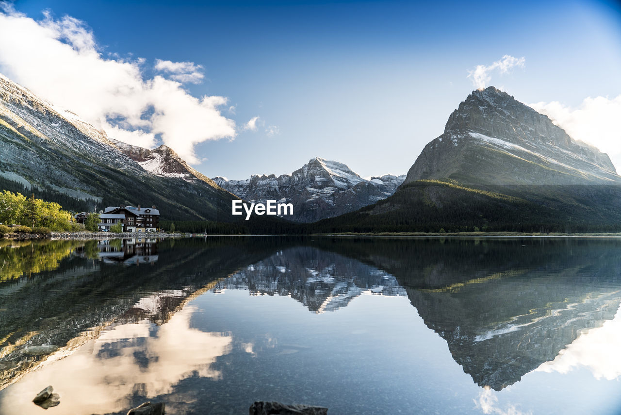 Scenic reflection of mountains in calm lake