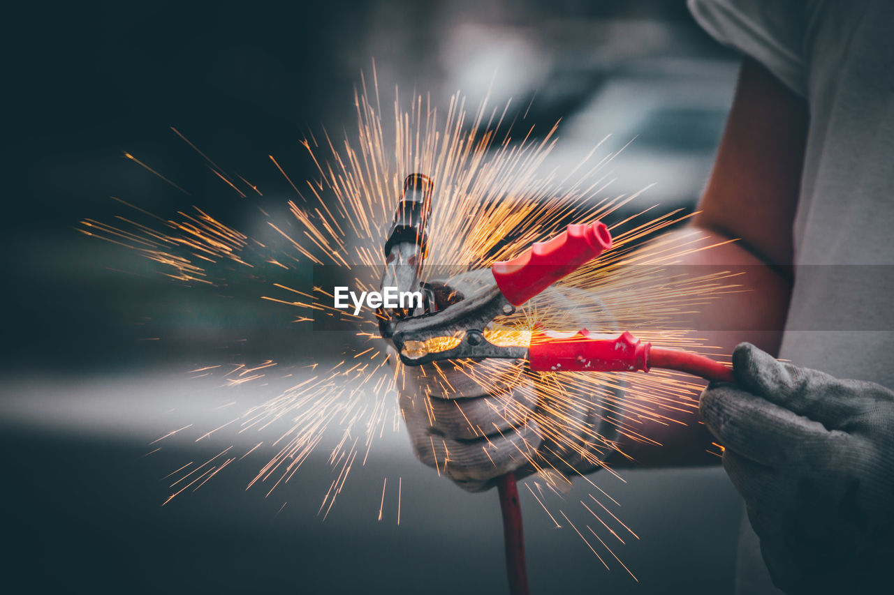 Close-up of hand holding fireworks