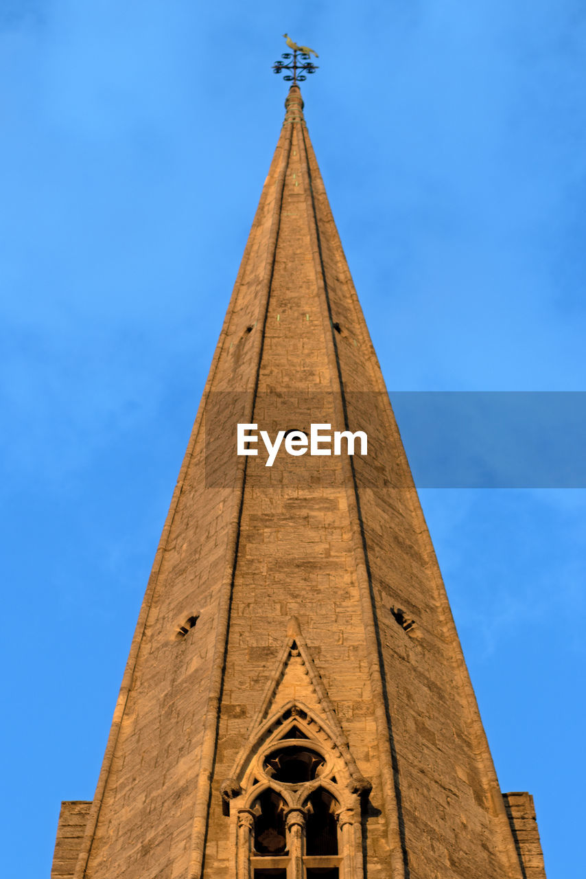 steeple, architecture, spire, sky, built structure, blue, tower, building exterior, religion, nature, history, place of worship, landmark, the past, building, low angle view, travel destinations, bell tower, no people, belief, day, spirituality, monument, outdoors, time, clock, travel, clear sky, triangle shape, cloud, sunny