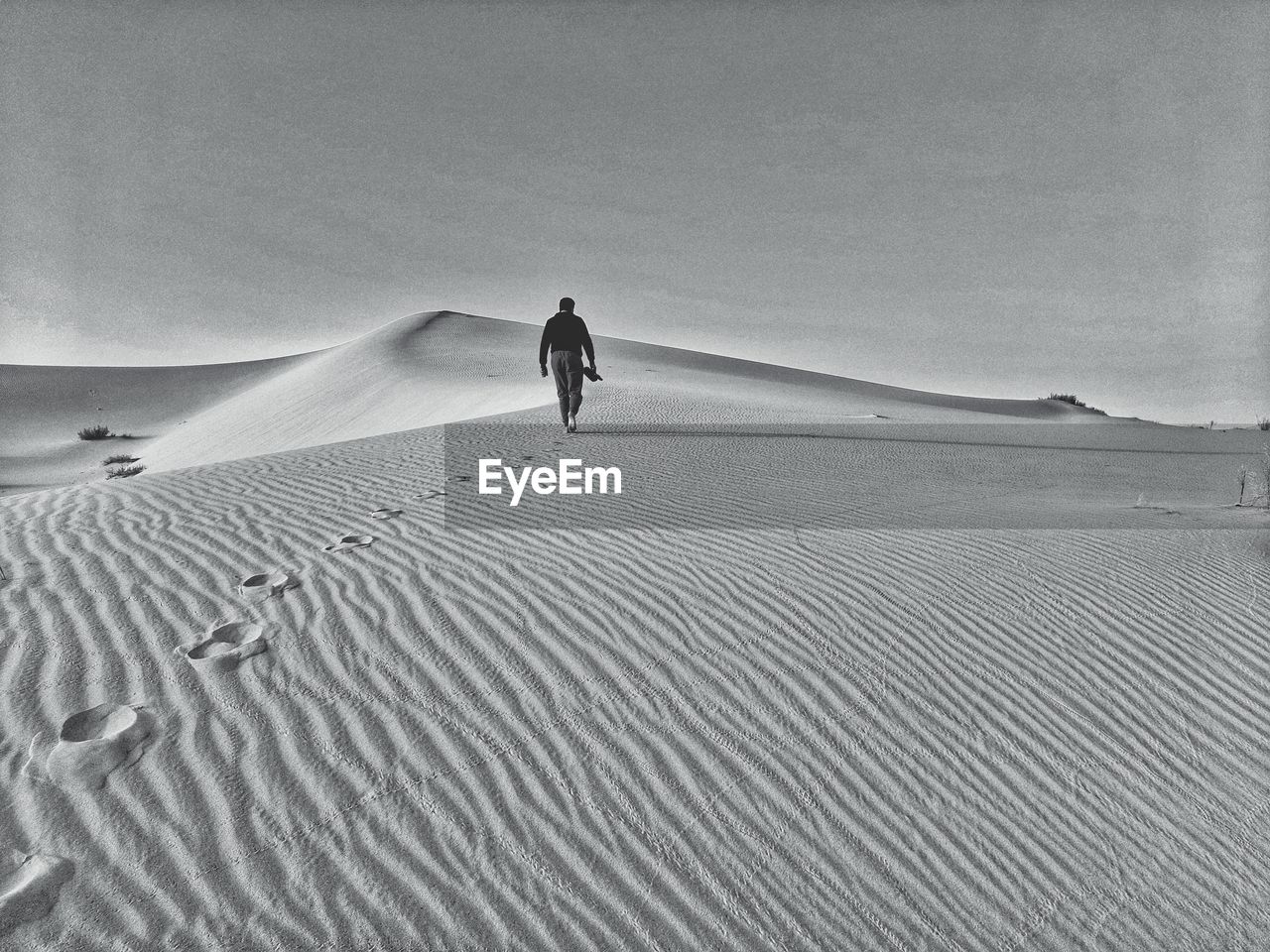 Walking on sand dunes on desert