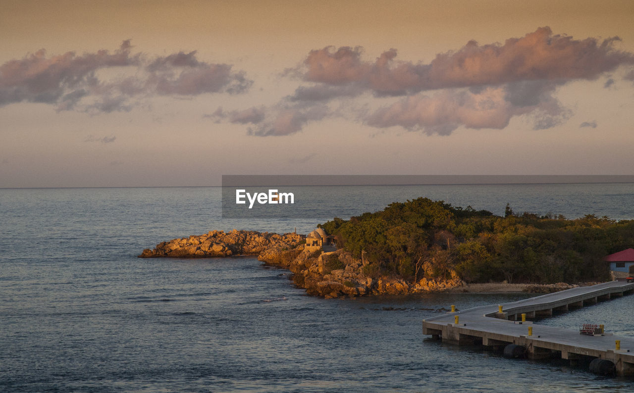 View of calm sea against cloudy sky