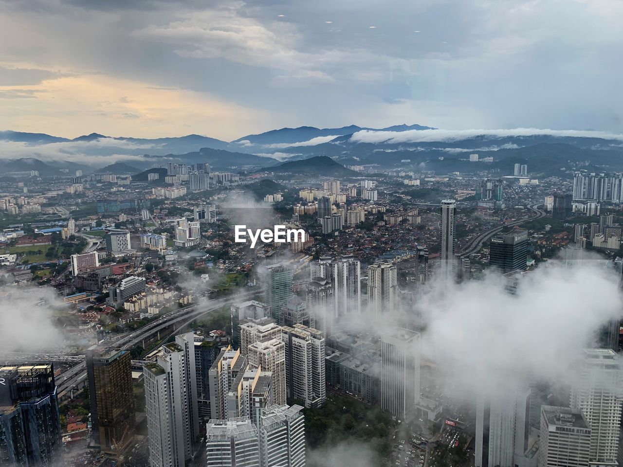 High angle view of buildings in city against sky