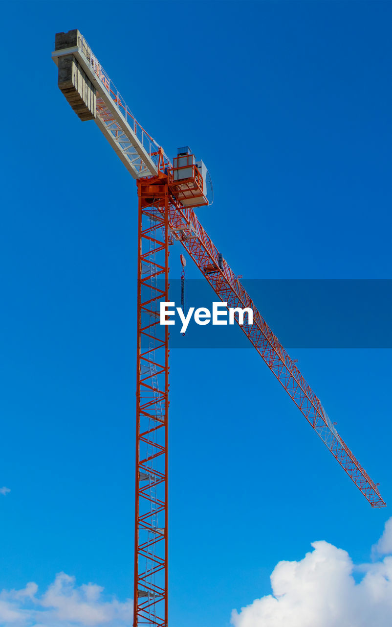 low angle view of crane against sky