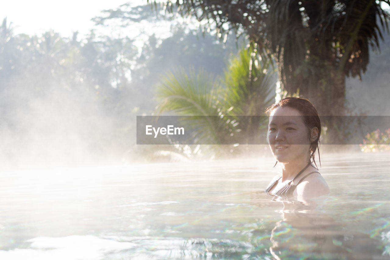 Woman swimming in pool