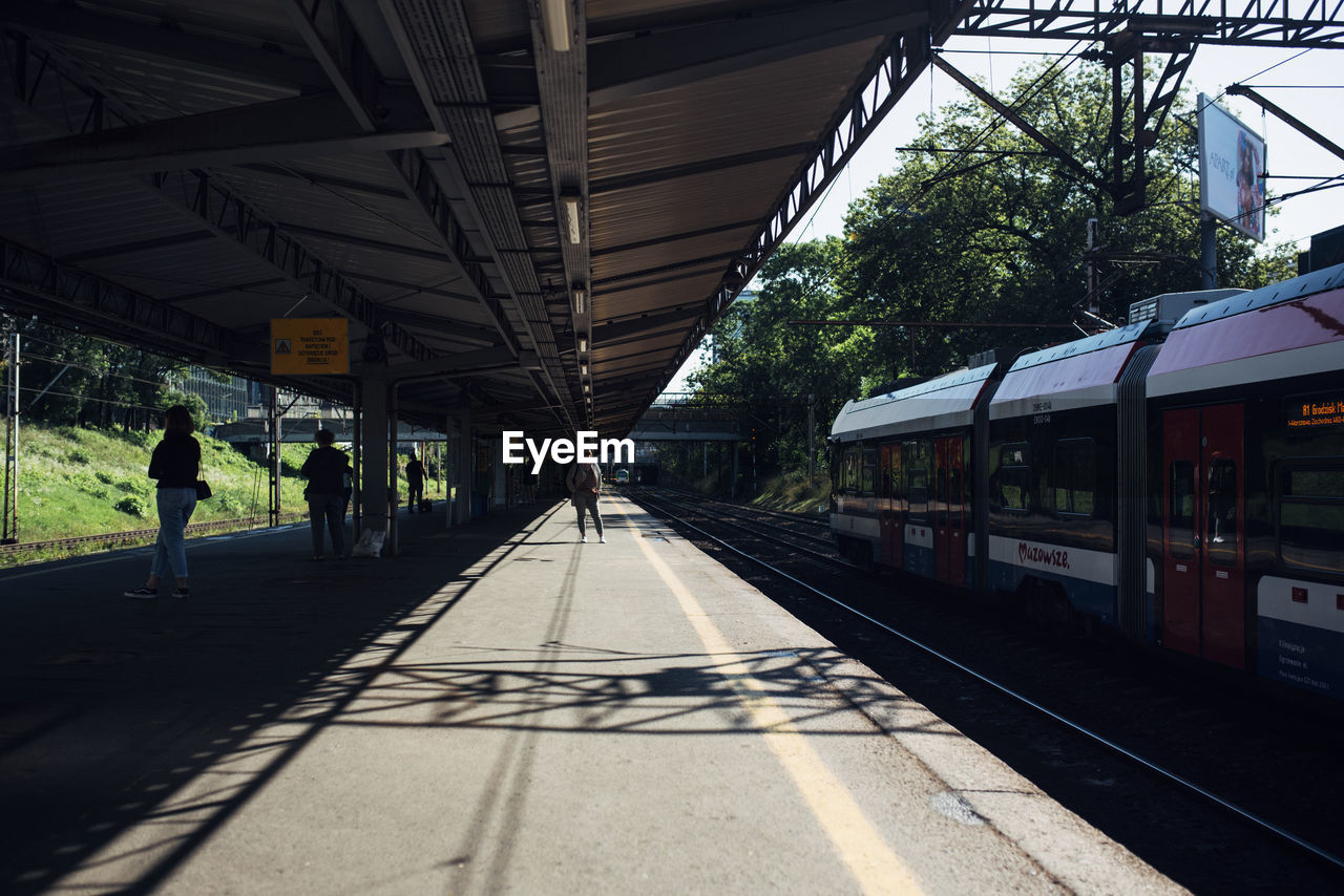 TRAIN IN RAILROAD STATION