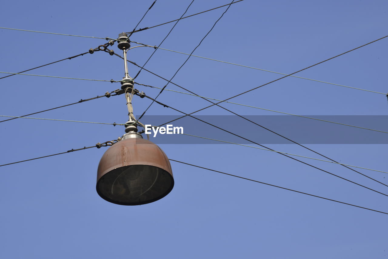 LOW ANGLE VIEW OF CABLES AGAINST CLEAR SKY