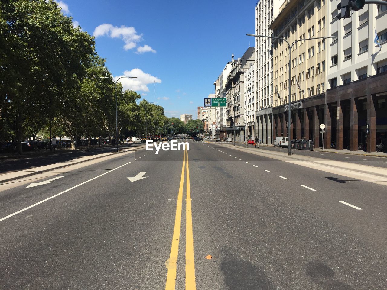 SURFACE LEVEL OF ROAD WITH STREET LIGHTS IN BACKGROUND