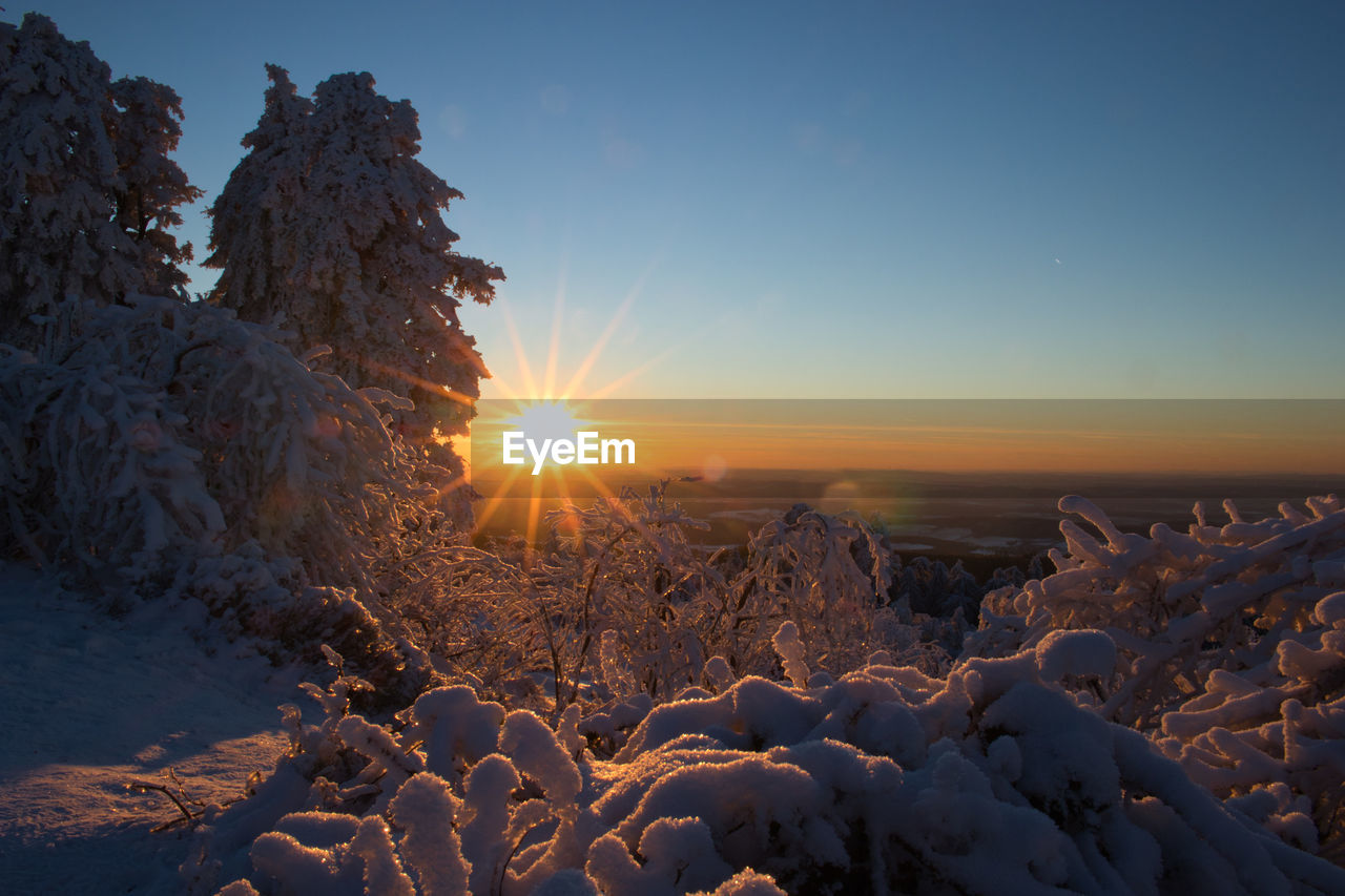 SCENIC VIEW OF SNOW DURING SUNSET