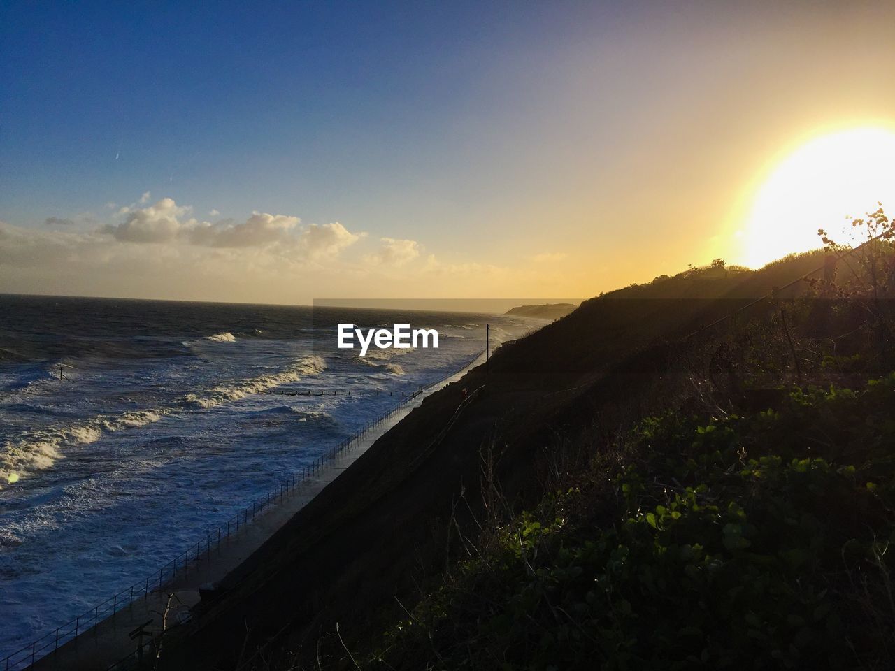 Scenic view of sea against sky during sunset